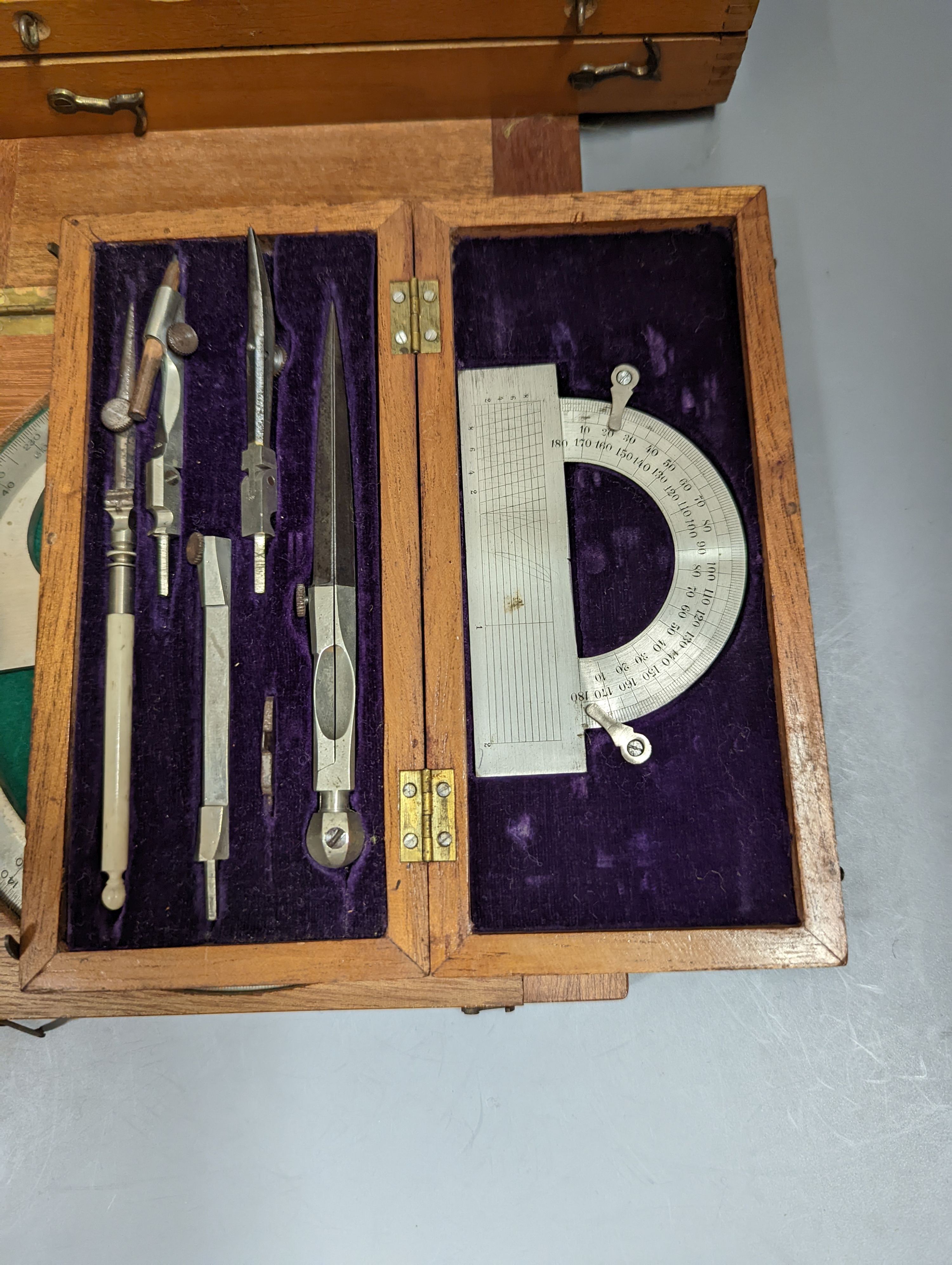 A collection of mahogany cased drawing instruments (8)